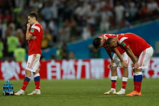 Russia's players react to their defeat on penalties by Croatia in the World Cup quarter-finals