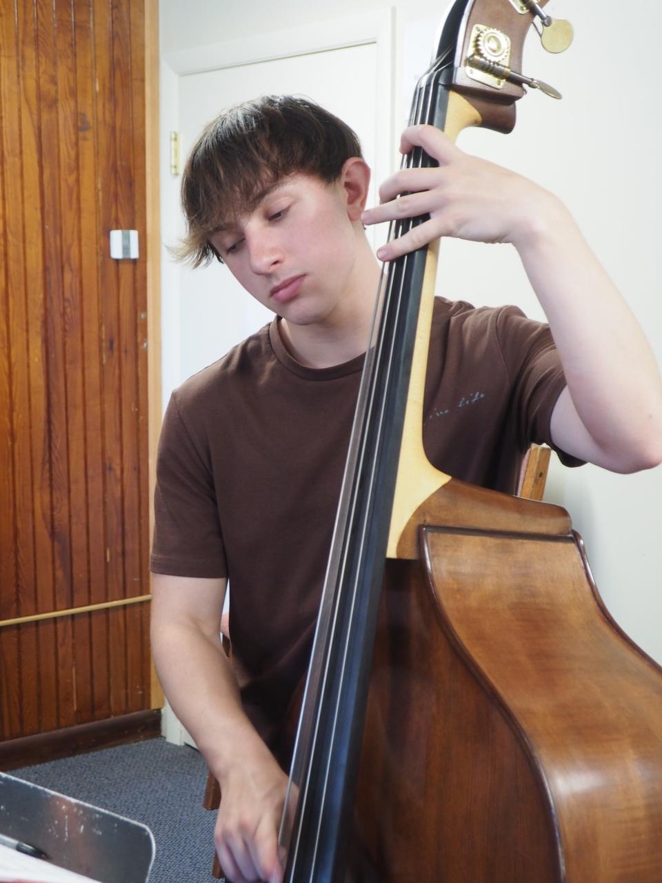 Logan Franklin of Knoxville, Tennessee plays upright bass at the Newport Jazz Summer Camp.