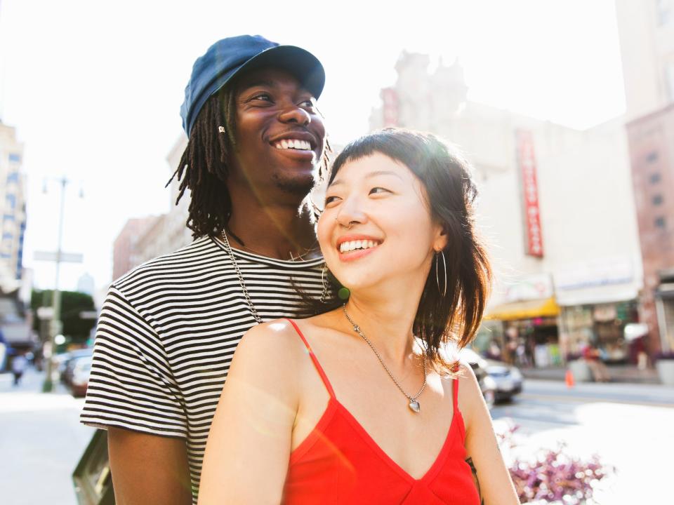 A young couple in a city street.