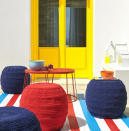 <p> Achieve a striking alfresco space with some bold blocking. The classic combination of punchy primary colors against a crisp white background instantly lifts a space.&#xA0; </p> <p> Add pattern and interest with textured floor cushions for a place you&#x2019;ll love to relax in.&#xA0;These outdoor pouffes, side table and outdoor rug from Ikea are perfect as an inexpensive way to transform your outdoor space. For a similar door paint, try Rust-Oleum Universal all-surface paint in Canary Yellow from Homebase.&#xA0; </p>
