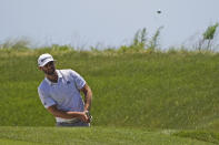 Dustin Johnson chips up to the sixth green on during the second round of the PGA Championship golf tournament on the Ocean Course Friday, May 21, 2021, in Kiawah Island, S.C. (AP Photo/Chris Carlson)