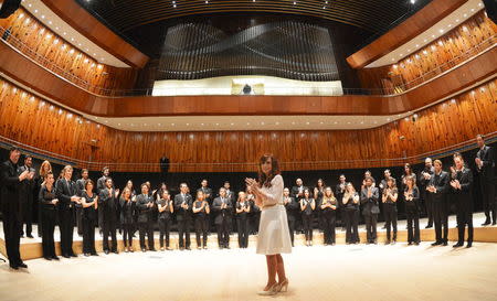 Argentina's President Cristina Fernandez de Kirchner applauds as she stands in front of musicians from Argentina's National Symphony Orchestra in the 'Blue Whale' auditorium during the official inauguration of the Kirchner Cultural Center in Buenos Aires, Argentina, May 21, 2015. REUTERS/Argentine Presidency/Handout via Reuters