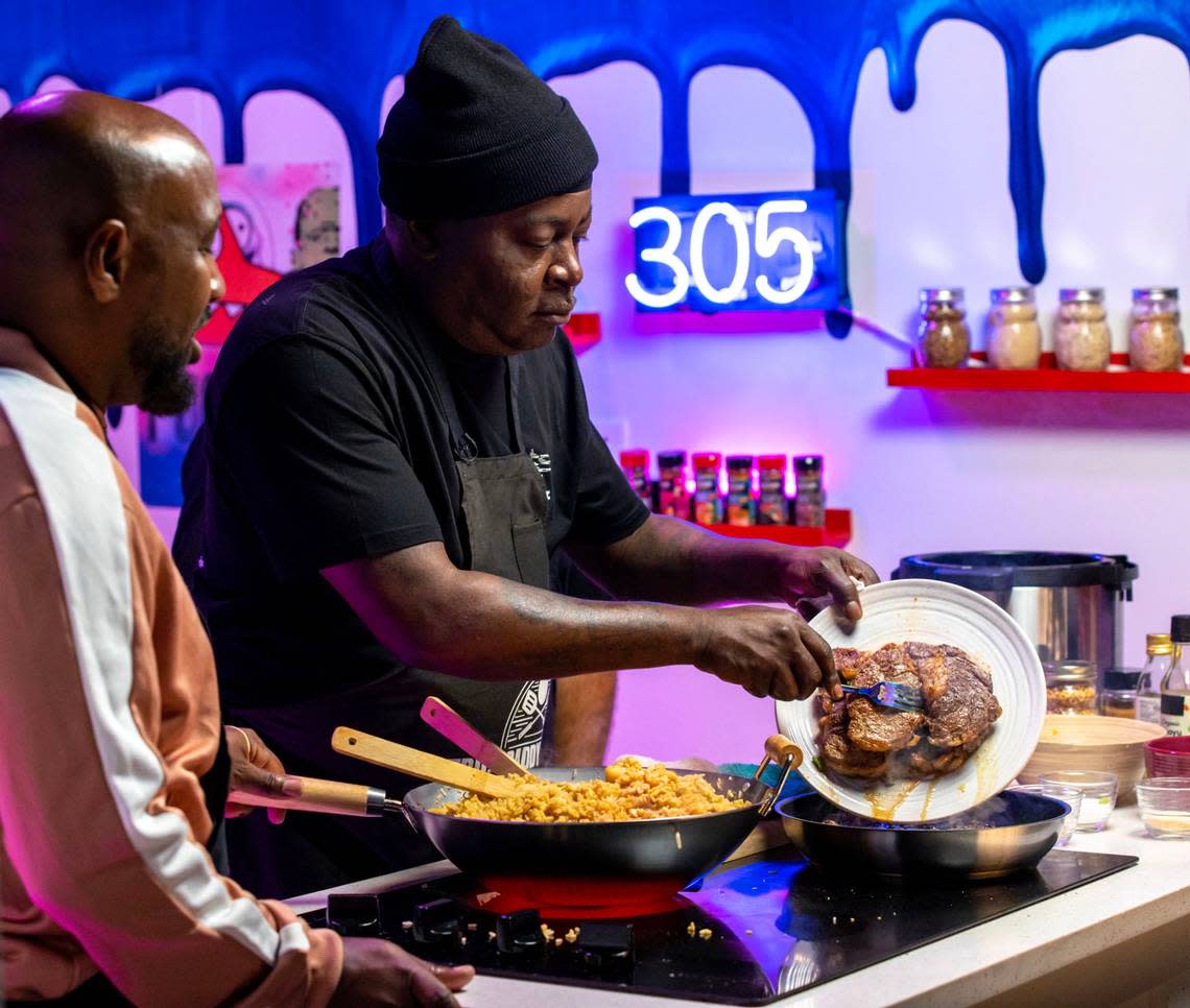 ‘B---- I Got my Pots’ co-host Corey ‘C.O.’ Evans watches Trick Daddy make steak and shrimp fried rice.