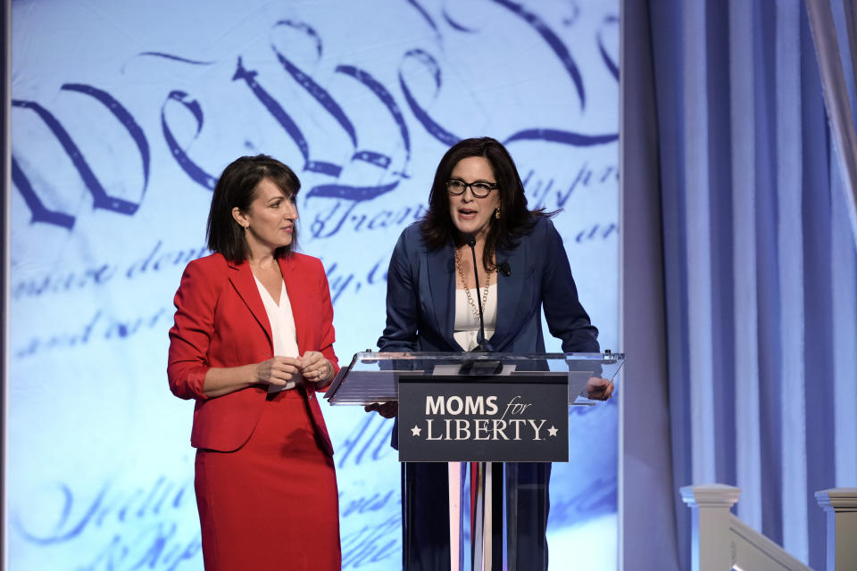 Moms for Liberty founders Tiffany Justice, right, and Tina Descovich speak at the Moms for Liberty meeting in Philadelphia, Friday, June 30, 2023. (AP Photo/Matt Rourke)