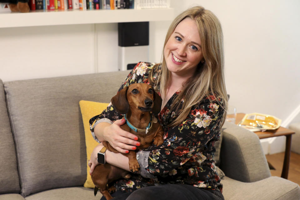 Katherine Sofoluke with her dog George at her home in Beckenham, Greater London, Tuesday, Aug. 13, 2019. Across Europe, pet owners like Katherine are seamlessly crossing borders with their beloved dog, cat or even ferret, thanks to the EU Pet Passport scheme. Now, as a no-deal Brexit looms for Britain, free pet travel is under threat. (AP Photo/Natasha Livingstone)