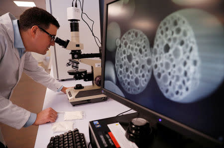 Chris Hughes, a Senior Specialist for Nestle, looks at the company's newly manufactured sugar structure in a laboratory inside their Product Technology Centre in York, Britain, March 21, 2018. REUTERS/Phil Noble