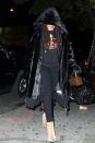 <p>In a hooded velvet coat, embroidered crown sweatshirt, black skinny jeans, beige crushed velvet booties and a Louis Vuitton bag while out in New York. </p>