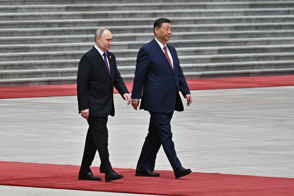 Chinese President Xi Jinping, right, and Russian President Vladimir Putin walk during an official welcome ceremony in Beijing, China, on Thursday, May 16, 2024. (Sergei Bobylev, Sputnik, Kremlin Pool Photo via AP)