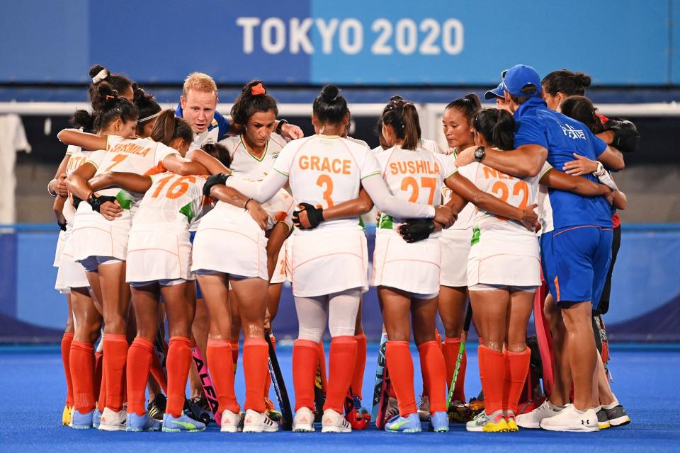 Players of India gather after losing 2-1 to Argentina in their women's semi-final match of the Tokyo 2020 Olympic Games field hockey competition, at the Oi Hockey Stadium in Tokyo, on August 4, 2021.