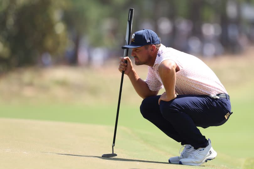 Bryson DeChambeau of the United States looks over a putt on the first hole during the third round of the 124th U.S. Open at Pinehurst Resort