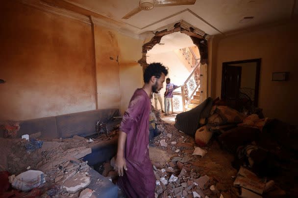 PHOTO: A man looks at the damage inside a house in Khartoum, Sudan, April 17, 2023. (Reuters)