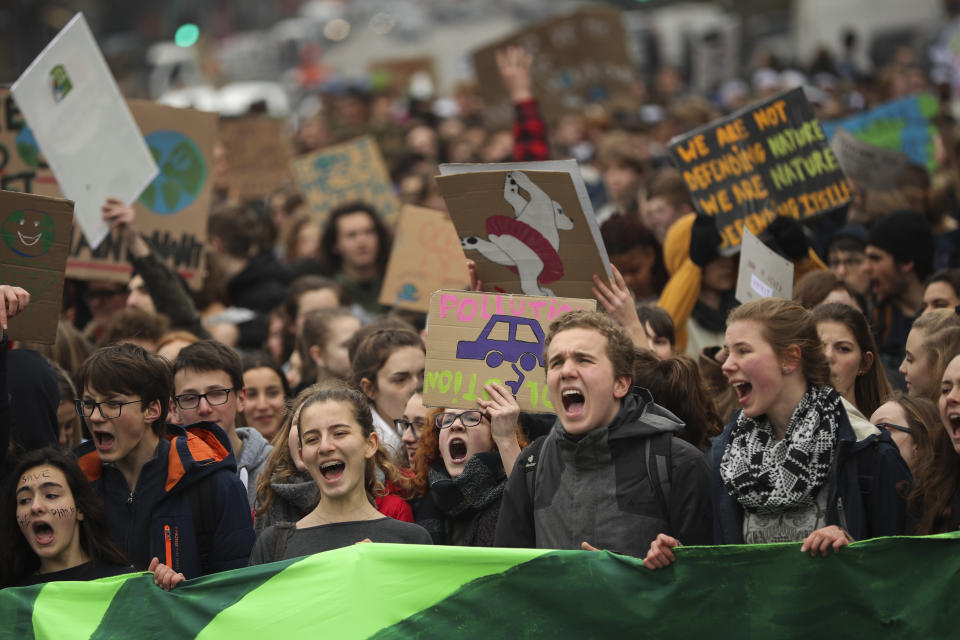 Youths shout slogans as they march during a climate protest in Brussels, Thursday, Feb. 28, 2019. This is the eighth week in a row that school students have skipped school to protest, with one march of about 3,000 in Antwerp and a few thousand in Brussels and other provincial centres. (AP Photo/Francisco Seco)