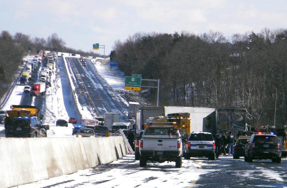 Traffic is backed up after two multi-vehicle accidents along Interstate 81 Wednesday morning, March 26, 2014, near Falling Waters, W.Va. West Virginia State Police say the two multi-vehicle accidents occurred during whiteout conditions, leaving two people dead and more than half a dozen others injured. (AP Photo/The Journal, Edward Marshall)