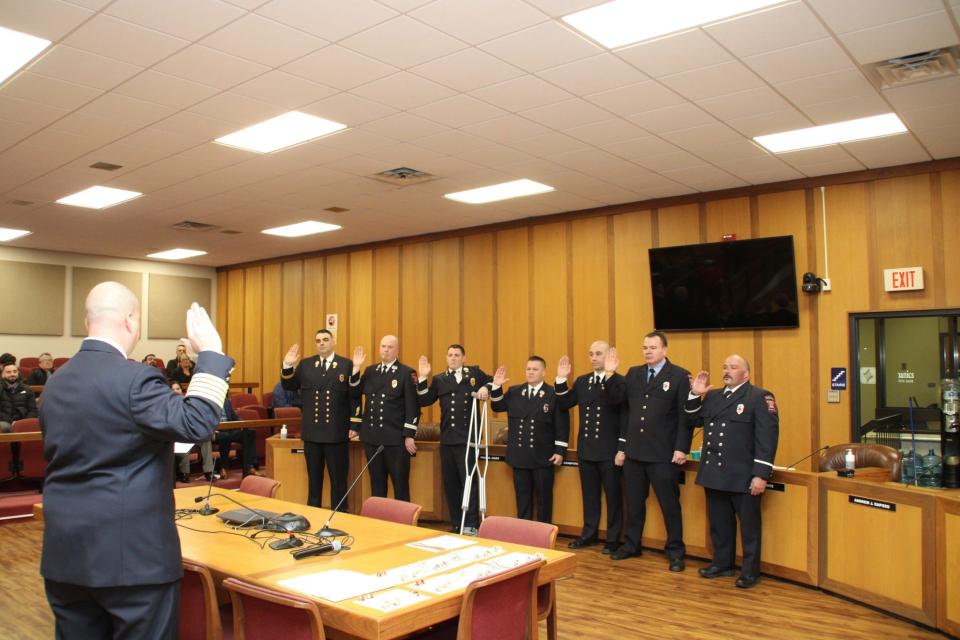 Newly promoted Fall River Fire Chief Jeffrey Bacon swears in a group of firefighters who were promoted at a ceremony on Thursday.