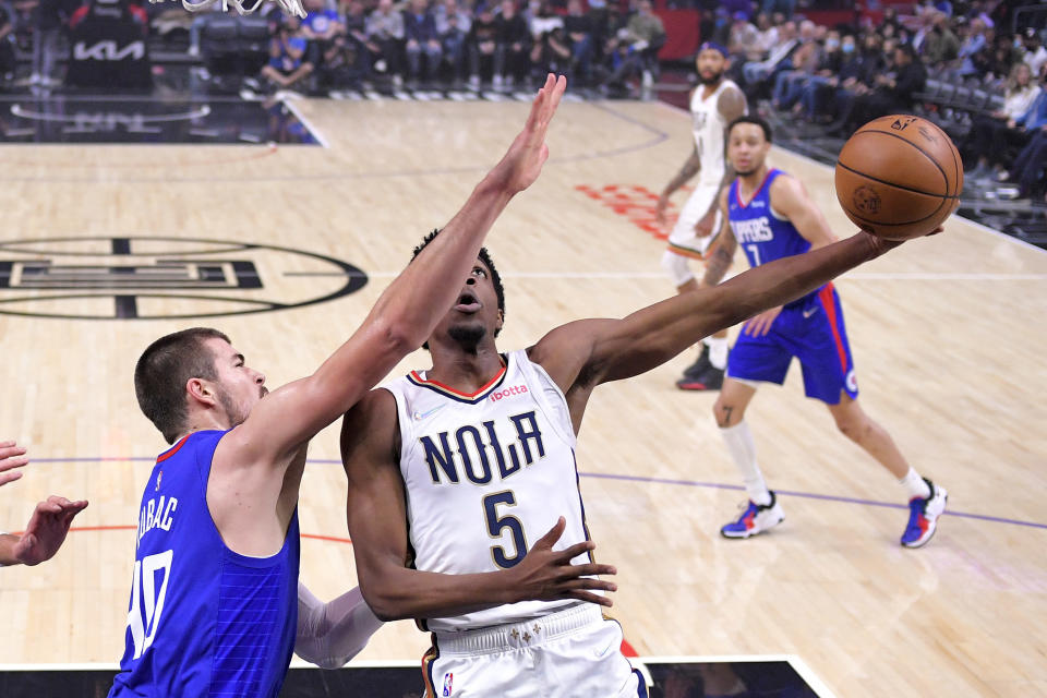 New Orleans Pelicans forward Herbert Jones, right, shoots as Los Angeles Clippers center Ivica Zubac defends during the first half of an NBA basketball game Monday, Nov. 29, 2021, in Los Angeles. (AP Photo/Mark J. Terrill)