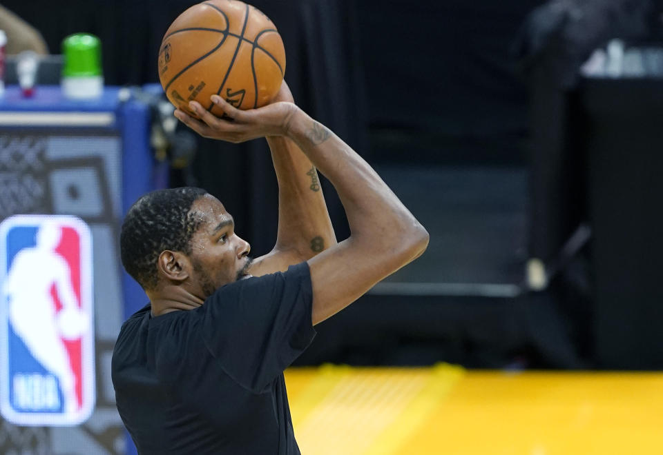 Kevin Durant #7 of the Brooklyn Nets warms up prior to the start of an NBA basketball game against the Golden State Warriors at Chase Center on February 13, 2021 in San Francisco, California. NOTE TO USER: User expressly acknowledges and agrees that, by downloading and or using this photograph, User is consenting to the terms and conditions of the Getty Images License Agreement. (Photo by Thearon W. Henderson/Getty Images)