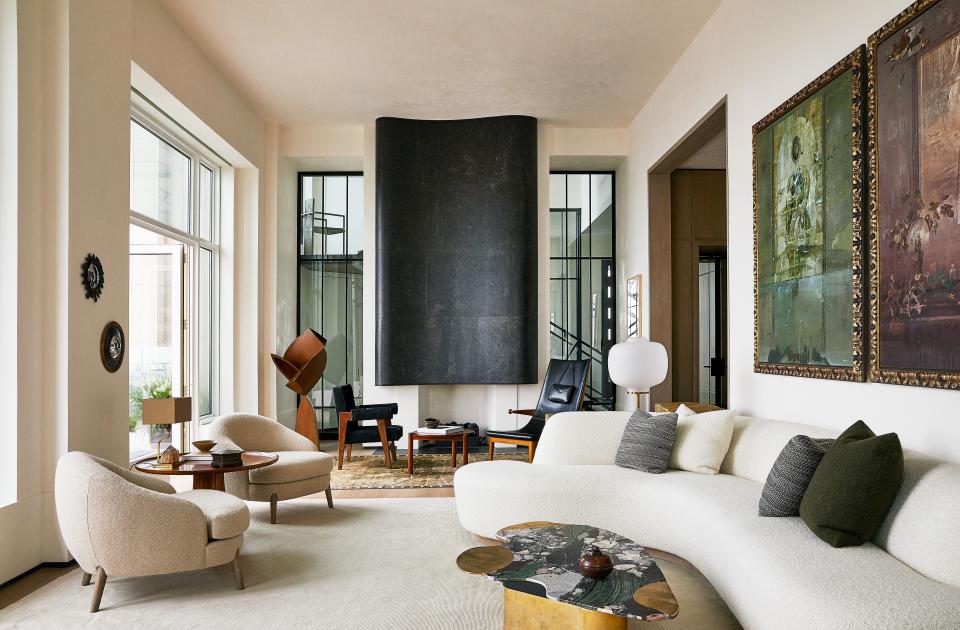 In the living room, a Vincenzo de Cotiis cocktail table stands in front of a custom sofa in a chapas textiles fabric.