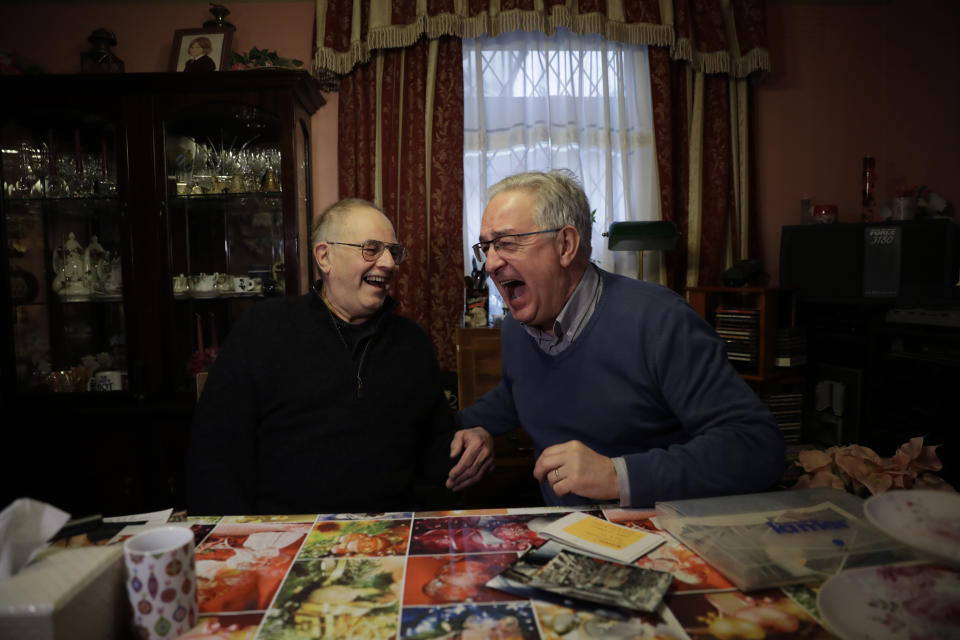 Former British Channel Tunnel worker Graham Fagg, left, and Former French Channel Tunnel worker Philippe Cozette laugh together during an interview with The Associated Press at Graham's home in Dover, England, Thursday, Jan. 30, 2020. By digging their way to each other deep under the English Channel, tunnelers Graham Fagg and Philippe Cozette became symbols for British-French friendship when they made the first breakthrough in the Channel Tunnel nearly 30 years ago. (AP Photo/Matt Dunham)