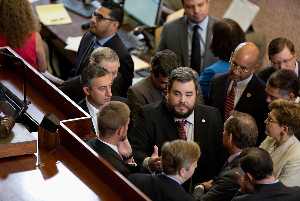 Huddle with Rep. Jonathan Stickland R-Bedford at the center on August 3, 2017