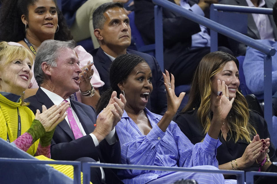 Michelle Obama, second from right, reacts during the semifinal match between Frances Tiafoe, of the United States, and Carlos Alcaraz, of Spain, at the U.S. Open tennis championships, Friday, Sept. 9, 2022, in New York. (AP Photo/John Minchillo)