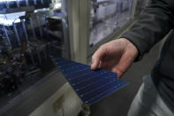 A broken solar panel is seen inside the Hanwha Qcells Solar plant, Monday, Oct. 16, 2023, in Dalton, Ga. (AP Photo/Mike Stewart)