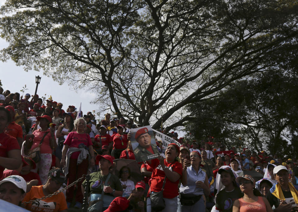 Supporters of Venezuela's President Nicolas Maduro gather for a rally outside the Miraflores Presidential Palace in Caracas, Venezuela, Saturday, Feb. 22, 2014. Venezuelans on both sides of the nation's political divide took to the streets on Saturday after nearly two weeks of mass protests that have Maduro scrambling to reassert his leadership. (AP Photo/Fernando Llano)