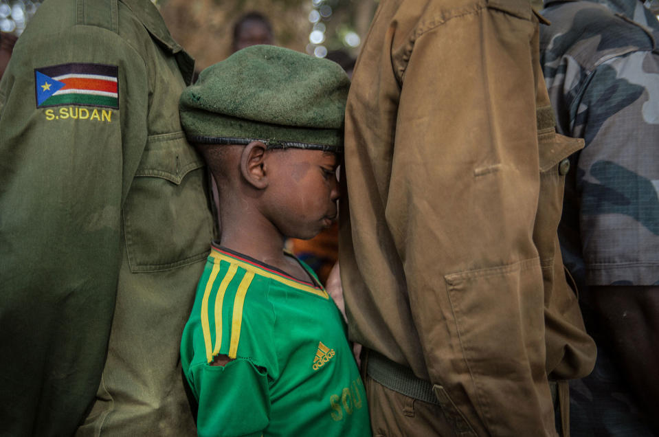 <p>Newly released child soldiers wait in a line for their registration during the release ceremony in Yambio, South Sudan on Feb. 7, 2018. (Photo: Stefanie Glinski/AFP/Getty Images) </p>