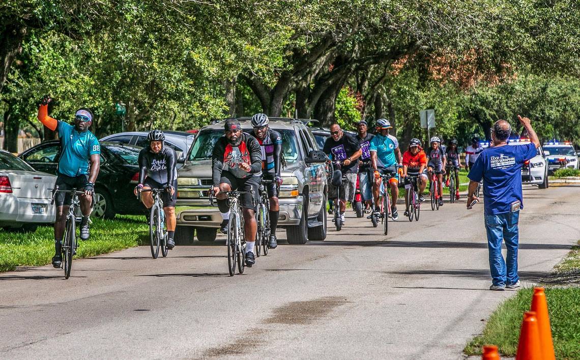 A group of voters from churches and community organizations arrive at the early voting site at the North Dade Regional Library, biking and driving from Calder Casino in Miami Gardens as part of the “Souls to the Polls” 2022, on Saturday August 20, 2022.