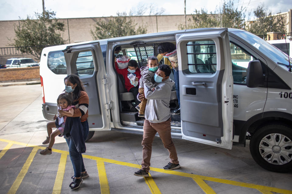 Asylum seekers are released by the U.S. Border Patrol at a bus station on Feb. 26, 2021 in Brownsville, Texas. (John Moore / Getty Images)