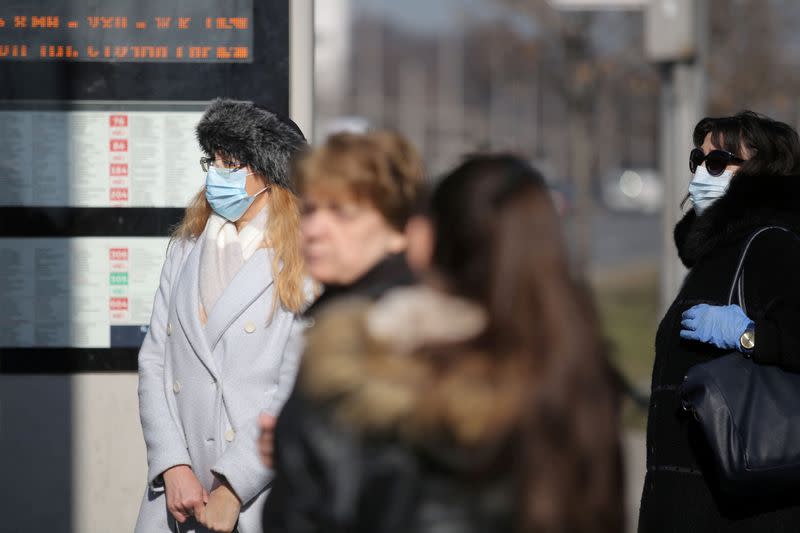 FILE PHOTO: Two Bulgarian women wearing protective masks are seen in Sofia downtown