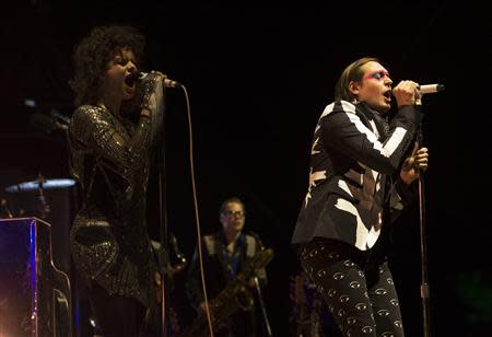 Lead vocalist Win Butler (R) and his wife Regine Chassagne of rock band Arcade Fire perform at the Coachella Valley Music and Arts Festival in Indio, California April 13, 2014. REUTERS/Mario Anzuoni