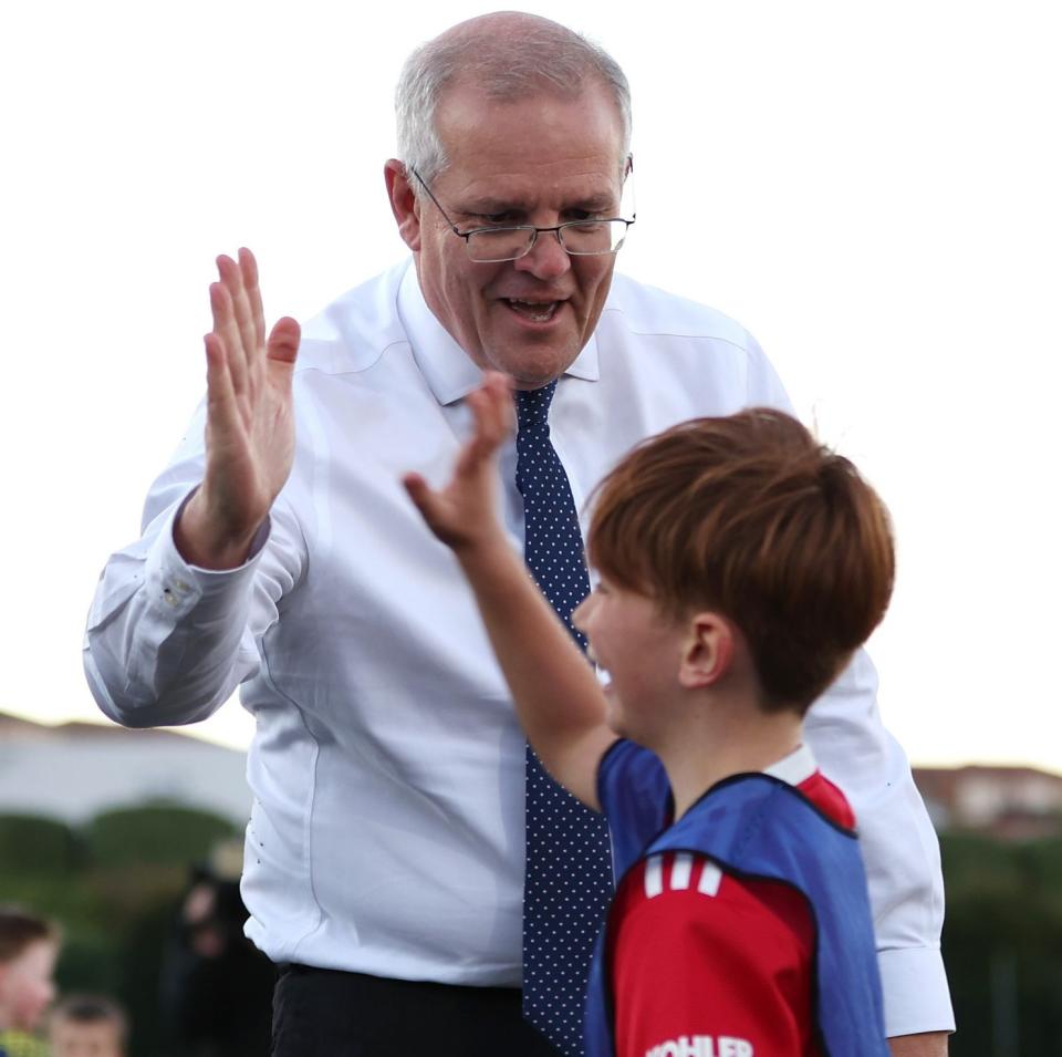 Scott Morrison channels his inner Boris Johnson as he rugby tackles a child - Asanka Ratnayake /Getty Images AsiaPac 