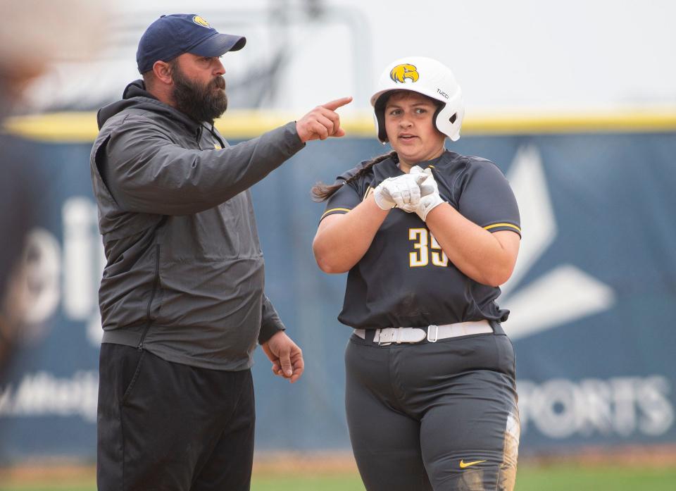 Rock Valley College head softball coach Darin Monroe  speaks to Evy Polsfuss on Tuesday, April 26, 2022, at Rock Valley College in Rockford.