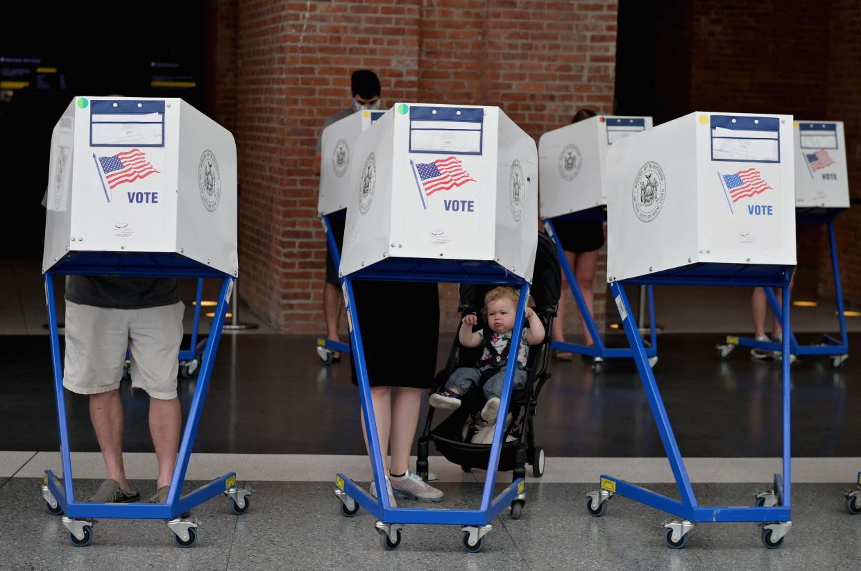 Residents vote during the New York City mayoral primary election at the Brooklyn Museum polling station on June 22, 2021, in New York City.