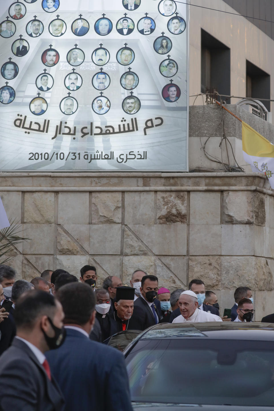 Pope Francis leaves the Sayidat al-Nejat (Our Lady of Salvation) Cathedral, in Baghdad, Iraq, Friday, March 5, 2021. Pope Francis has arrived in Iraq to urge the country's dwindling number of Christians to stay put and help rebuild the country after years of war and persecution, brushing aside the coronavirus pandemic and security concerns. (AP Photo/Andrew Medichini)