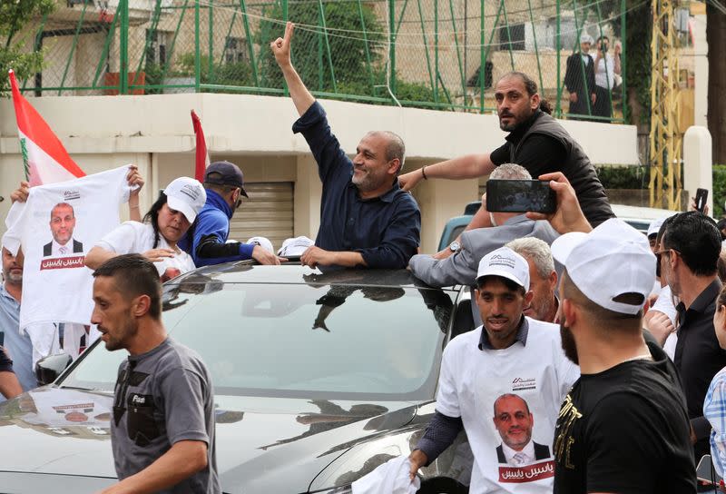 Opposition candidate in Lebanon's parliamentary election, Yassin Yassin, is greeted by supporters, in Jeb Jennin