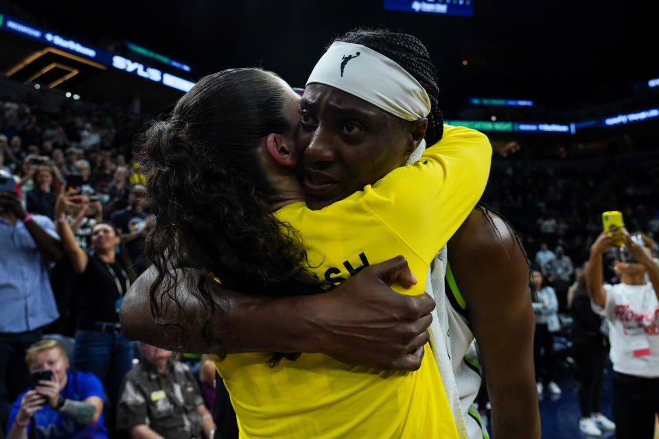 MINNEAPOLIS, MN - AUGUST 12: Sylvia Fowles #34 of the Minnesota Lynx (R) and Sue Bird #10 of the Seattle Storm embrace after the game at Target Center on August 12, 2022 in Minneapolis, Minnesota. Both Bird and Fowles are retiring at the end of the season. The Storm defeated the Lynx 96-69. NOTE TO USER: User expressly acknowledges and agrees that, by downloading and or using this Photograph, user is consenting to the terms and conditions of the Getty Images License Agreement. (Photo by David Berding/Getty Images)