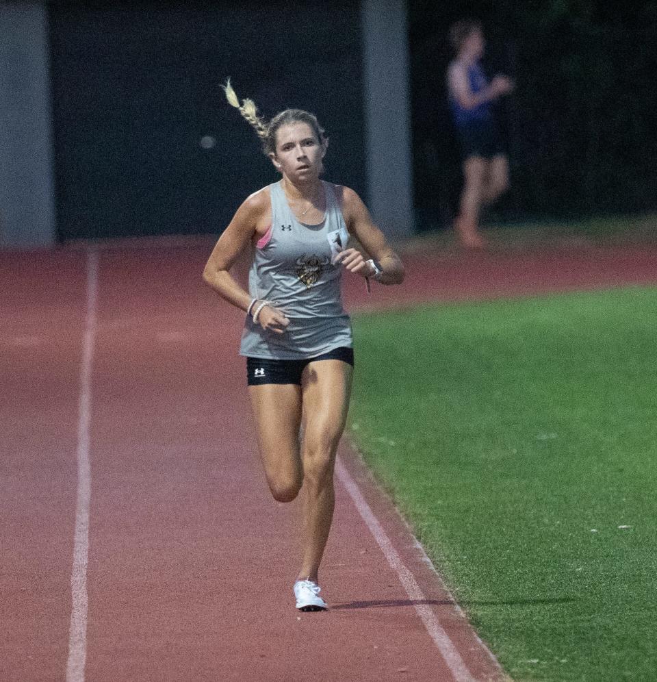 Mackenzie De Lisle from Bishop Verot competes with the boys in the 3200 during the Private 8 track and field meet at Evangelical School on Friday, April 19, 2024. She had the fastest girls time.