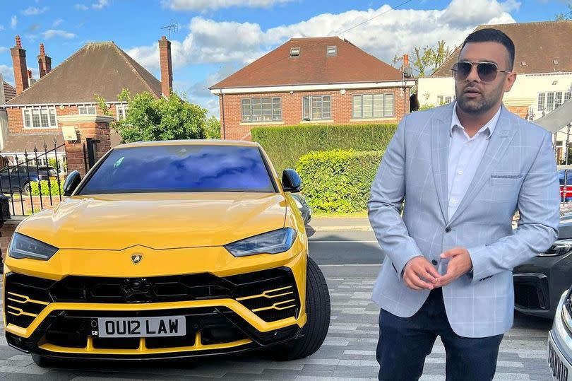 Birmingham lawyer Akhmed Yakoob with his car