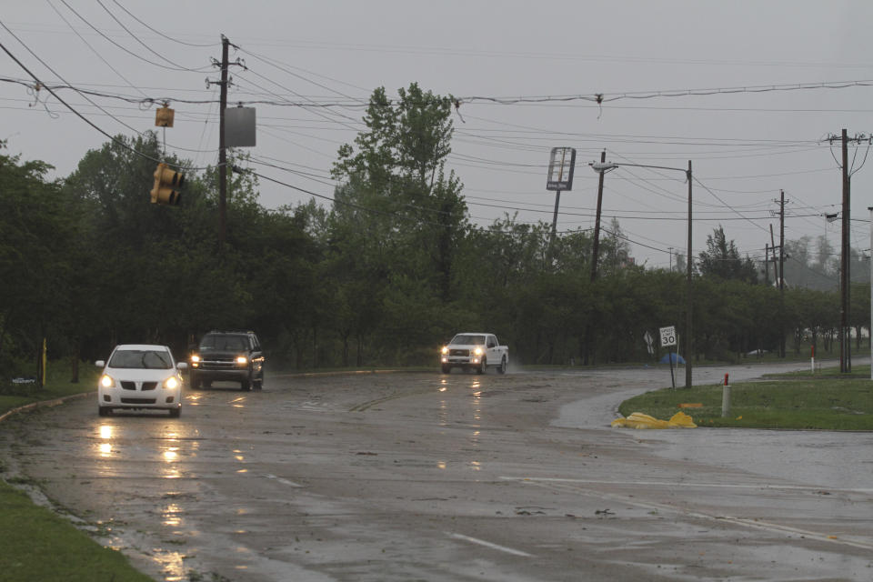 Vehicles travel on Pemberton Square Boulevard under missing and damaged traffic lights following severe weather, Saturday, April 13, 2019 in Vicksburg, Miss. Authorities say a possible tornado has touched down in western Mississippi, causing damage to several businesses and vehicles. John Moore, a forecaster with the National Weather Service in Jackson, says a twister was reported Saturday in the Vicksburg area of Mississippi and was indicated on radar. (Courtland Wells/The Vicksburg Post via AP)