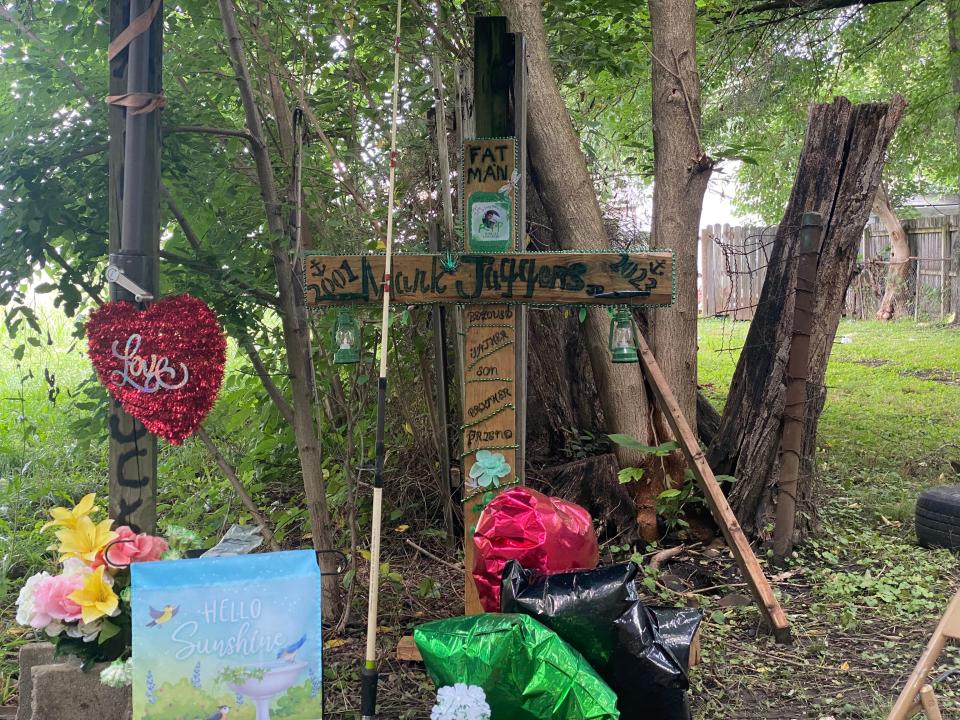 A memorial set up in the alley where 21-year-old Mark Jaggers Jr. was fatally shot by LMPD Officer Matt Hayden on June 19.