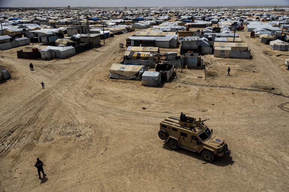 FILE - Kurdish forces patrol al-Hol camp, which houses families of members of the Islamic State group in Hasakeh province, Syria, on April 19, 2023. Iraq is stepping up repatriation of its citizens from a camp in northeastern Syria housing tens of thousands of people, mostly wives and children of Islamic State fighters but also supporters of the militant group. It’s a move that Baghdad hopes will reduce cross-border militant threats and eventually lead to shutting down the facility. (AP Photo/Baderkhan Ahmad, File)