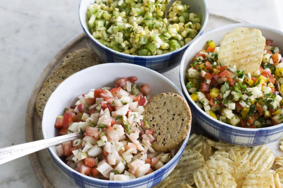 In this image taken on June 3, 2013, from top clockwise, cucumber-corn salsa, apple-pepper salsa and strawberry-fennel salsa are shown served in bowls in Concord, N.H. (AP Photo/Matthew Mead)