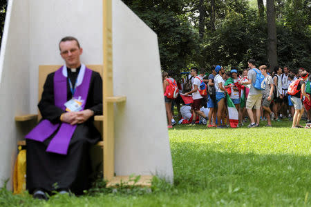 A priest waits for faithful in confessional during World Youth Day in Krakow, Poland, July 26, 2016. Agencja Gazeta/Jakub Porzycki/via REUTERS