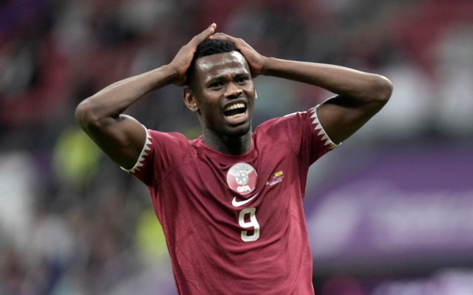 Qatar's Mohammed Muntari reacts after missing a chance - AP