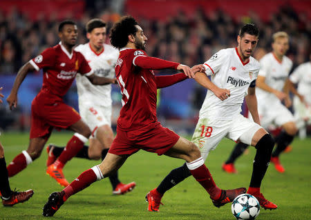 Soccer Football - Champions League - Sevilla vs Liverpool - Ramon Sanchez Pizjuan, Seville, Spain - November 21, 2017 Liverpool's Mohamed Salah in action with Sevilla’s Sergio Escudero REUTERS/Jon Nazca