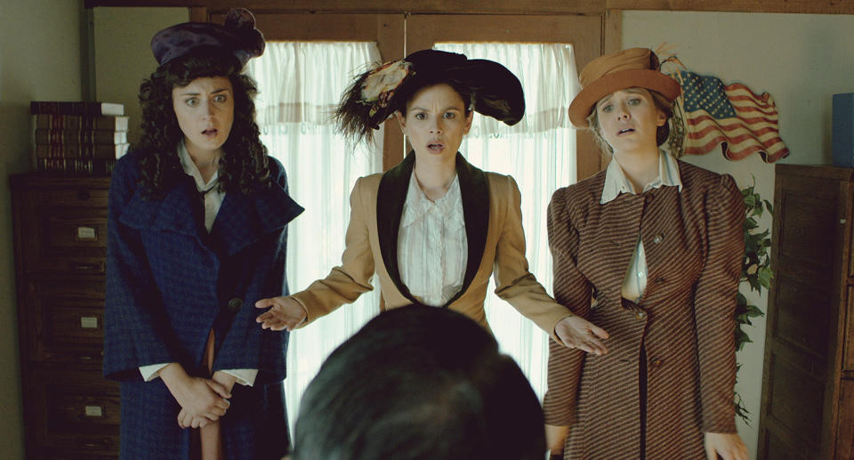 Maria Blasucci as Fleurette Kopp, Rachel Bilson as Constance Kopp, and Elizabeth Olsen as Norma Kopp in <em>Drunk History</em>. (Photo: Comedy Central)