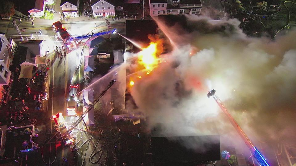 A drone image shows flames engulfing Block Island's historic Harborside Inn the night of Aug. 18, as first responders struggled to protect nearby structures on Water Street.