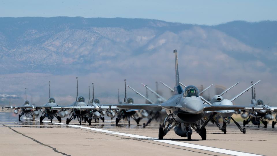 Forty-nine F-16 Vipers and MQ-9 Reapers assigned to the 49th Wing line up on the runway during an elephant walk at Holloman Air Force Base, New Mexico, April 21, 2023. The 49th Wing is the Air Force’s largest F-16 and MQ-9 formal training unit, building combat aircrew pilots and sensor operators ready for any future conflicts.