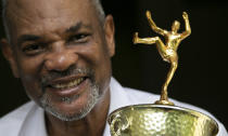 - Benn Fields holds a high jump trophy, Friday, July 31, 2020, in Salisbury Mills, N.Y. Fields will forever be known as a U.S. Olympian, he will also always wonder about what might have been had the U.S. government not spearheaded a boycott of the 1980 Olympic Games in Moscow. (AP Photo/Mark Lennihan)